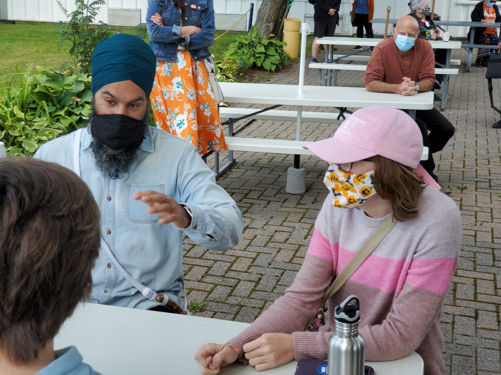 Jagmeet Singh speaks with supporters at a campaign event.
